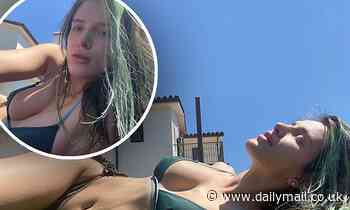 Bella Thorne looks fresh-faced as she lounges around her backyard in tiny bikini during quarantine