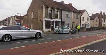 Car badly damaged after smashing through wall