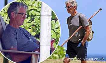 Pierce Brosnan goes hiking to his favorite reading spot while social distancing in Hawaii