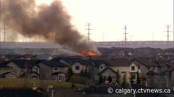 Flame and smoke seen coming from southeast Calgary home