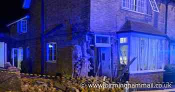 Car left a crumpled wreck after smashing into house