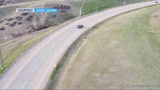 Drone captures senior narrowly missing oncoming traffic on highway outside Lethbridge