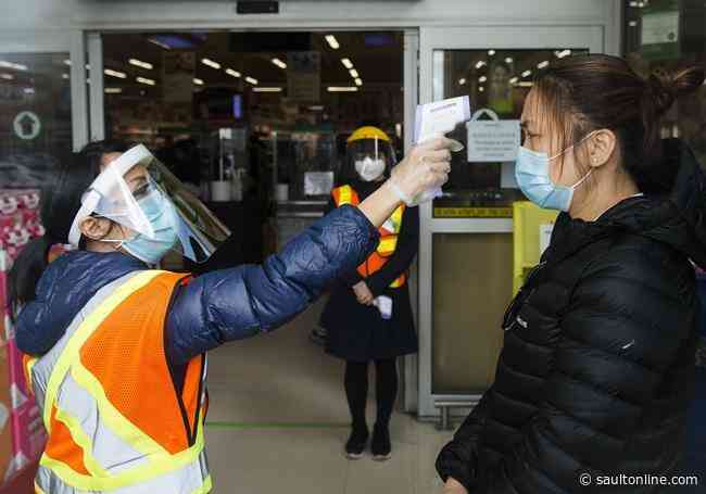 Companies beef up COVID-19 measures with masks and temperature checks