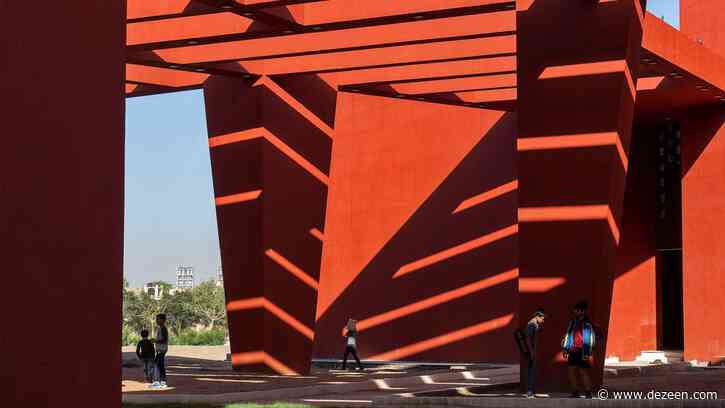 Towering red beams shade walkways of Rajasthan School in India