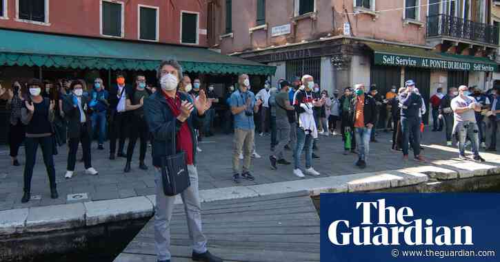 Italians dance and clap as toughest coronavirus lockdown measures lifted – video