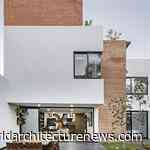 Fluid dialogue of materials palette unify Mexican family home