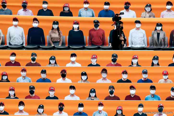 UK becomes virus epicenter of Europe; South Korea plays baseball