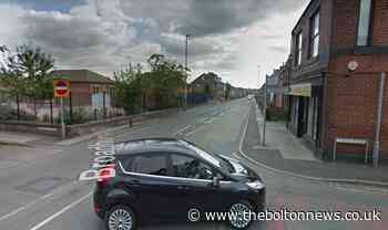 Road shut in traffic collision in Radcliffe with flipped car