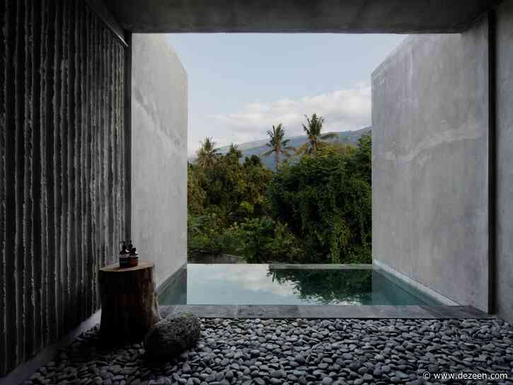 Rough concrete walls frame jungle views at The Tiing hotel in Bali