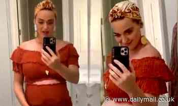 Katy Perry pulls down her skirt to show off bare baby bump while talking self-isolation with Orlando