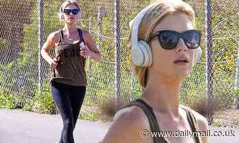 Christina Anstead wears a 'peace' tank top while showing off her slender figure