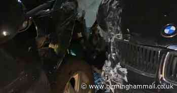 Driver leaves behind injured woman after ploughing into parked car