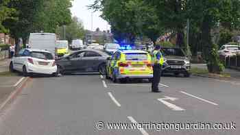 Mercedes blocks major road after colliding with parked car in Latchford