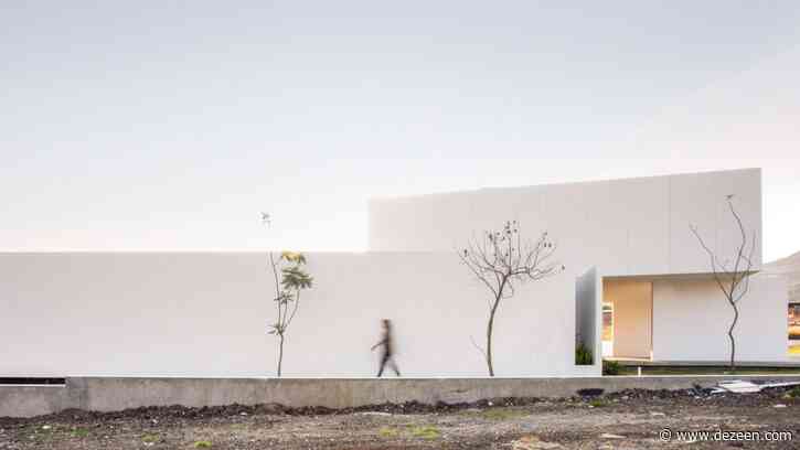 Splayed and stacked white volumes form San Antonio House in Mexico