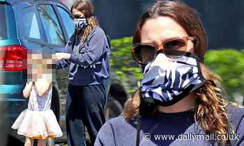 Drew Barrymore is every inch the hands-on mom as she ties her daughter's face mask