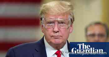 Live and Let Die plays as Donald Trump visits mask factory without a mask – video