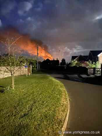 Fuel tank bursts into flames after fire breaks out in wooden decking