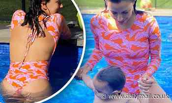 Eva Longoria flashes her backside as she splashes around in the pool with her son
