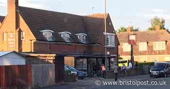 People gather outside two Bristol pubs as they reopen