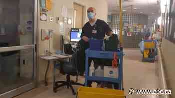 He cleans 'COVID rooms' in the ICU — and keeps dying patients company