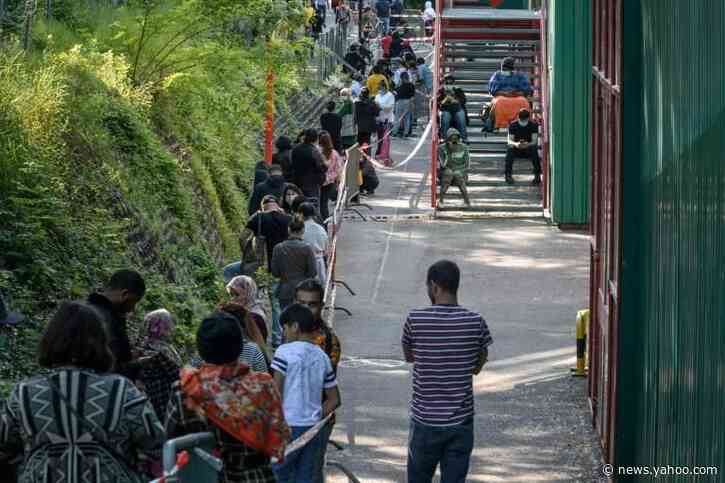 Crisis lays bare poverty in Geneva, as thousands queue for food