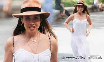 Myleene Klass nails summer chic in a white maxi dress and a fedora