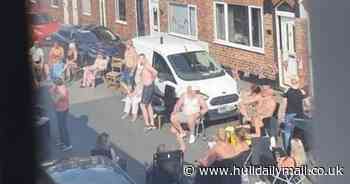 Street party revellers huddle together during VE Day celebrations