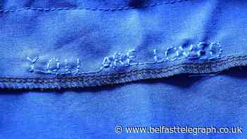 Seamstress sews ‘You Are Loved’ message into hospital scrubs