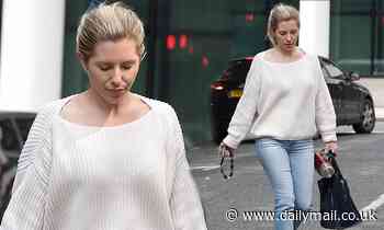Mollie King keeps it casual in a baggy sweatshirt and jeans