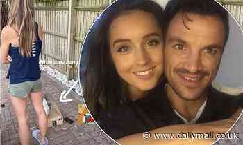 Peter Andre admires his wife's perky posterior in a cheeky snap
