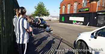 Flowers laid outside Tariq Khan's gym as locals pay respects - The Bolton News