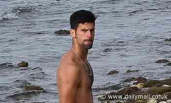 Tennis ace Novak Djokovic rolls up his shorts as he enjoys some relaxation on the beach in Marbella