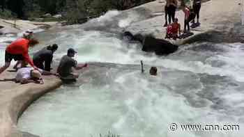 Watch a hiker being pulled from a whirlpool
