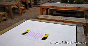 Signs put on pub beer garden tables to stop people using them