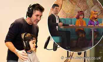 Simon Cowell shares sweet snap in a recording booth with son Eric, six, for Scooby Doo recording