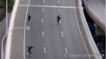 Police issue fines after video surfaces showing group skateboarding on Toronto highway - CTV News