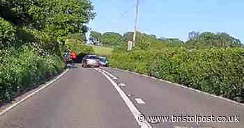 Driver almost hits oncoming vehicle while overtaking cyclist