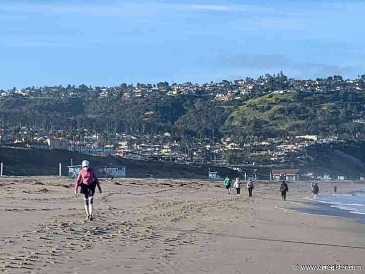 Beachgoers hit surf and sand at L.A. beaches — but official opening has yet to be announced