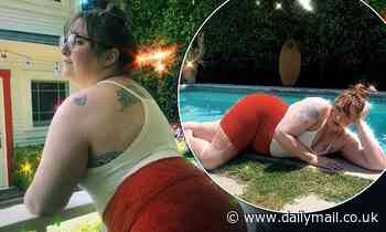 Lena Dunham poses by her pool in a vest top and cycling shorts