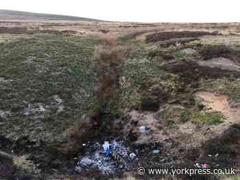 Crutches and artificial Xmas tree among rubbish dumped in sinkhole and set alight