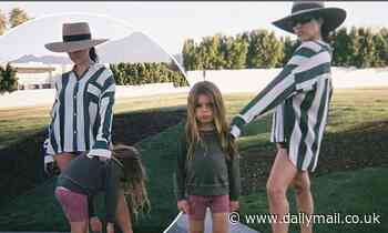 Kourtney Kardashian flaunts her legs as she poses with 'Mama's boy' Reign, 5