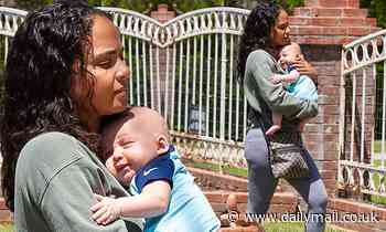 Christina Milian is every inch the adoring mother as she tenderly holds her newborn son