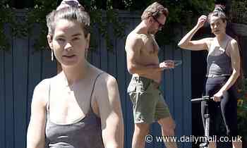 Michelle Monaghan displays her midriff on a scooter next to shirtless husband Peter White