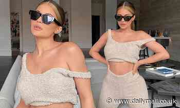 Kylie Jenner showcases her taut abs as she relaxes at her $36.5m mansion wearing fuzzy crop top