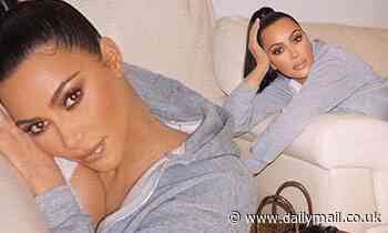 Kim Kardashian shows off her $120K Birkin bag as she lounges around in full glam