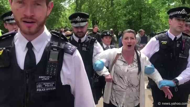 Scuffles as police lead away anti-lockdown protesters in London