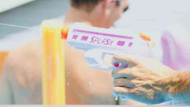 Priest draws squirt gun in fight against coronavirus