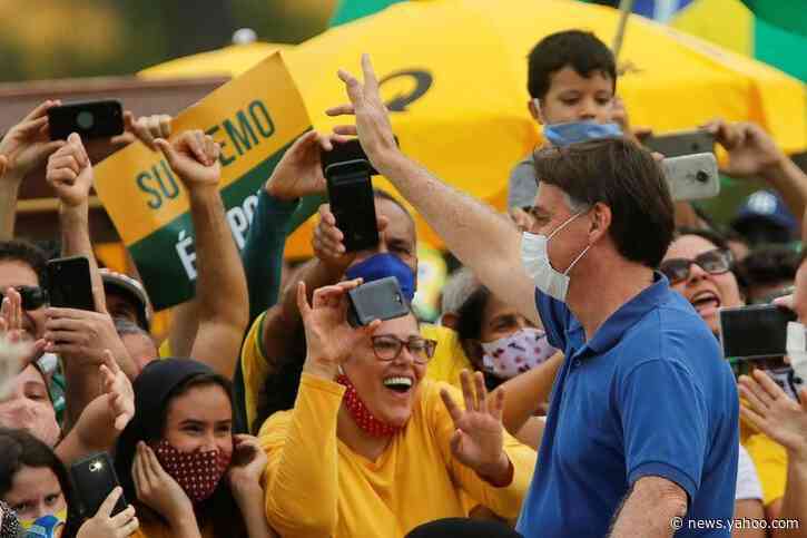 Bolsonaro snaps photos with children at Brazil protest, defying health advice