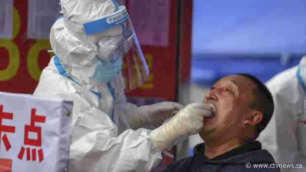 U.S. autoworkers return, while possible vaccine shows promise