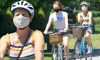 Molly Shannon masks up for a bike ride with her look-a-like daughter, Stella, 16, in Santa Monica